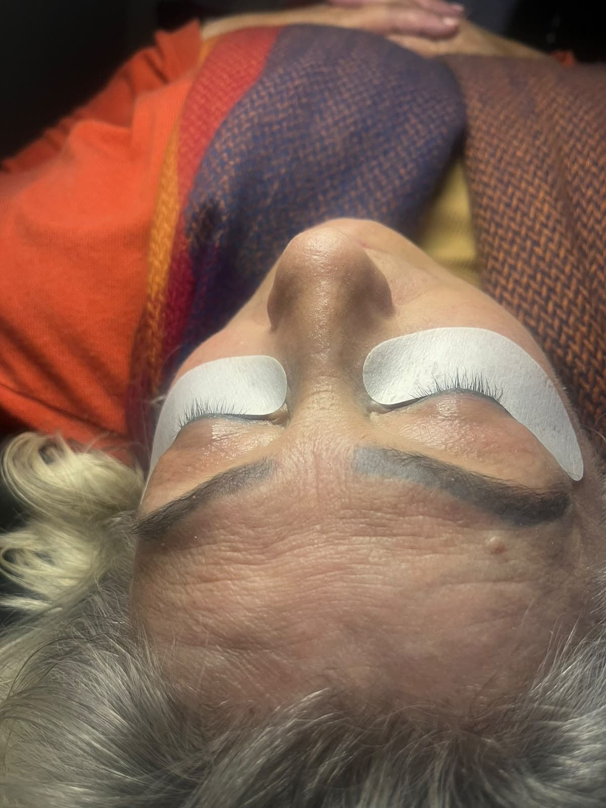 Close-up of eyelash extensions applied with under-eye pads