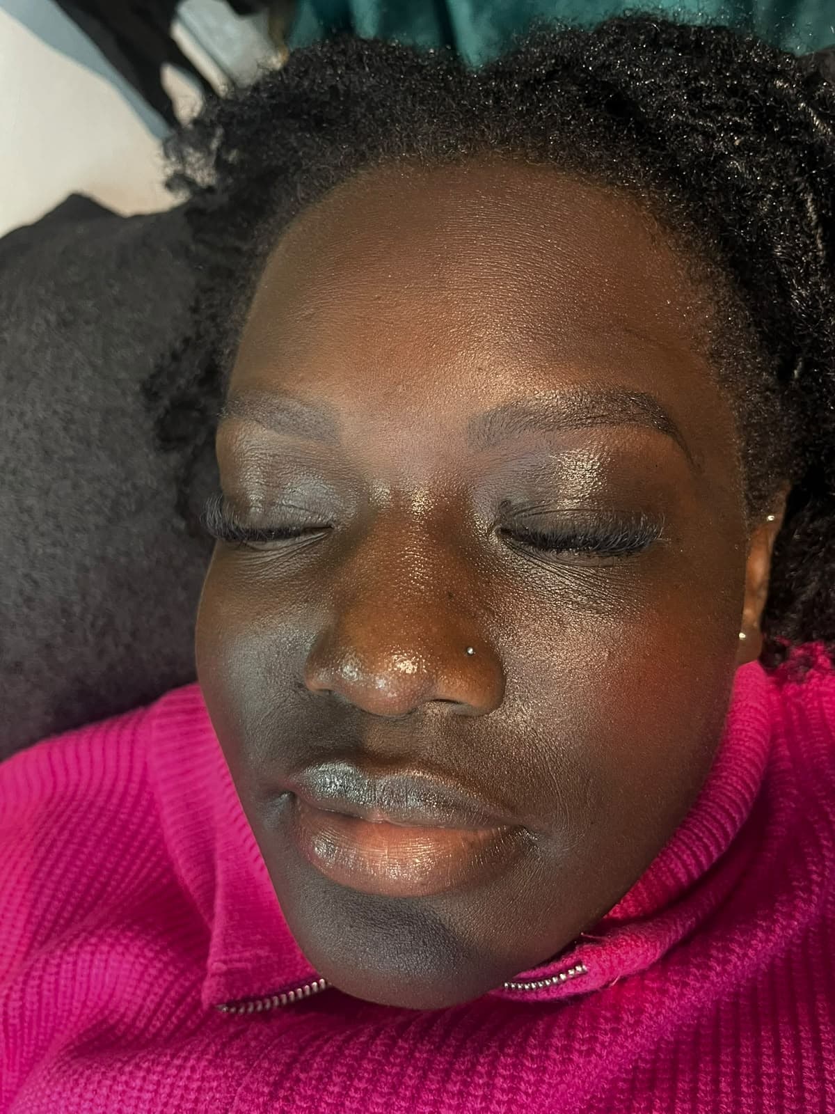 Full, fluffy eyelash extensions result on a relaxed client