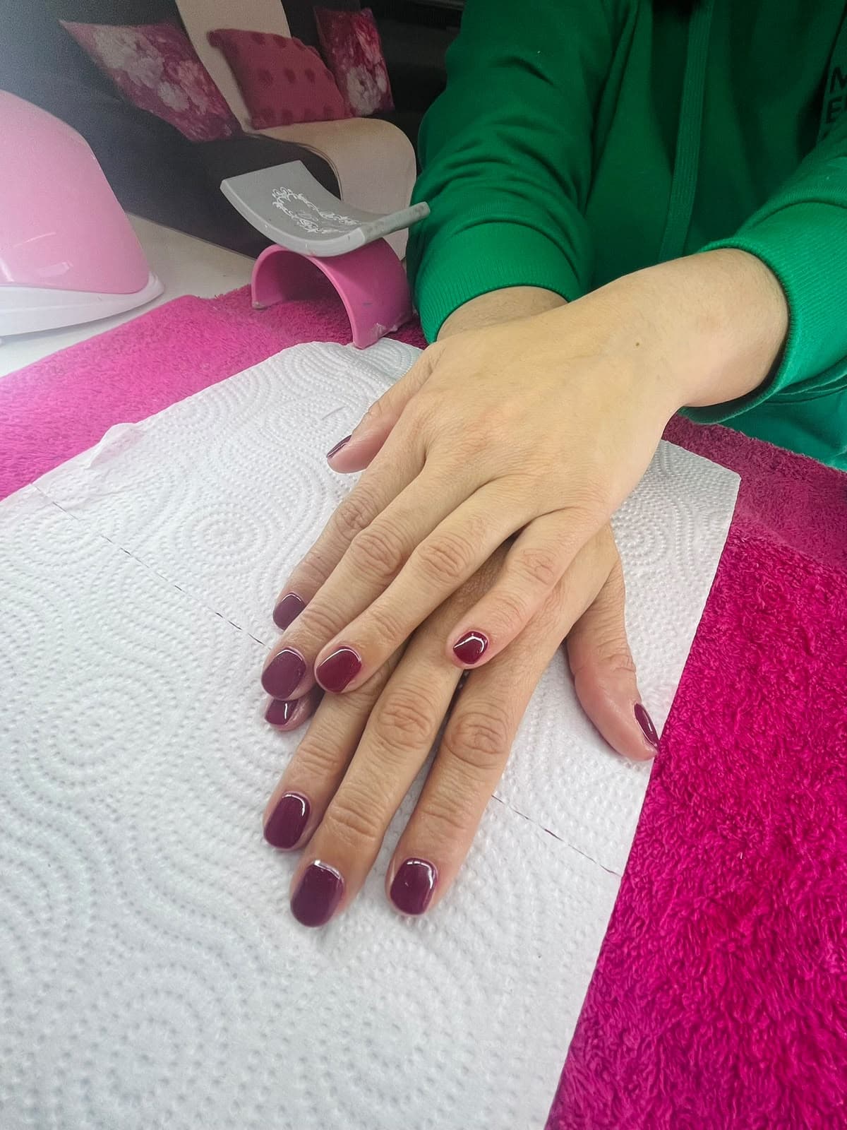 Deep plum gel manicure on short nails at a Lansdowne nail salon