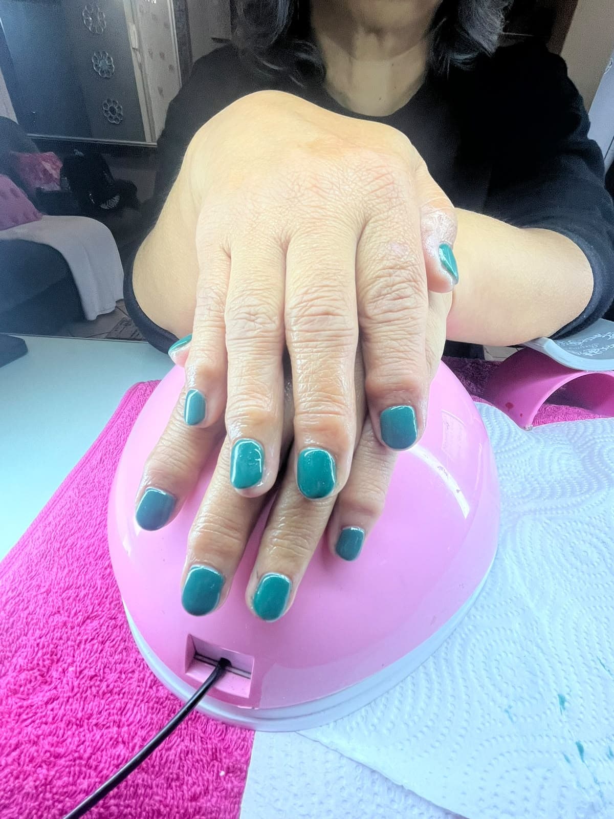 Glossy teal gel manicure on short natural nails