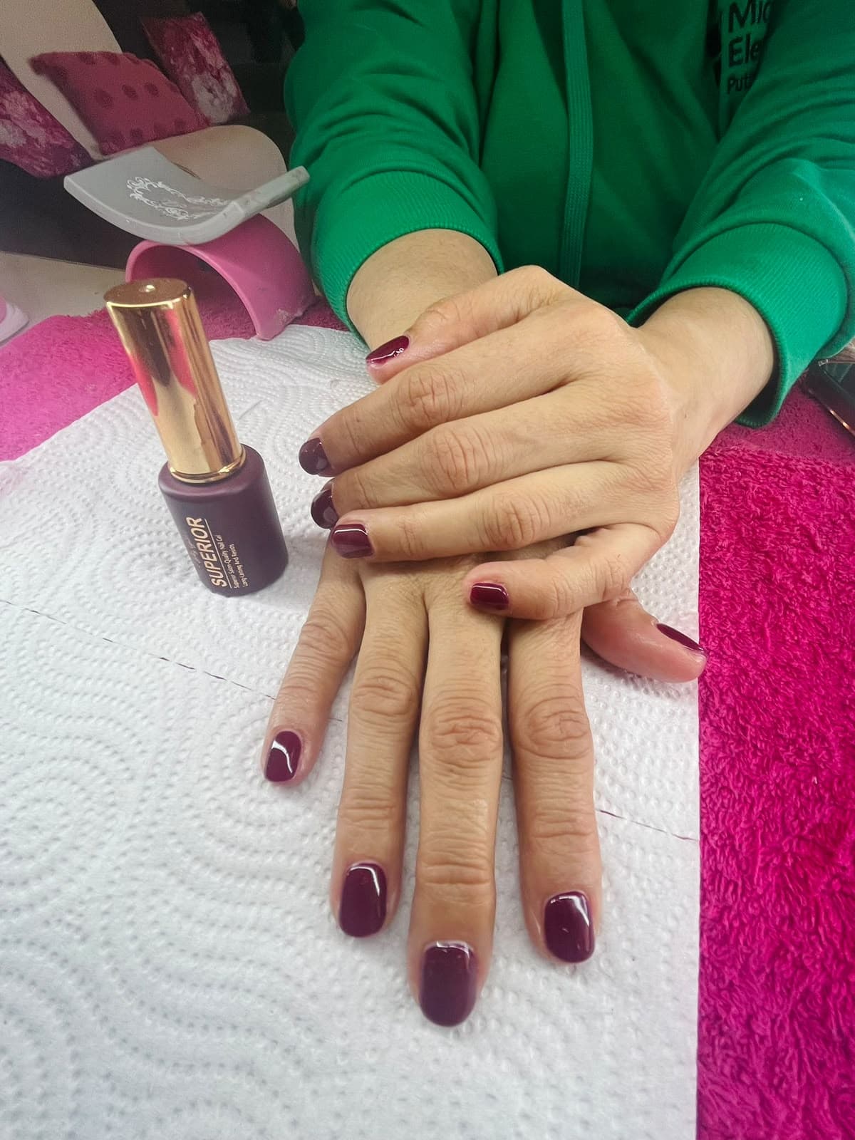 Plum burgundy gel polish on short nails, salon-quality finish